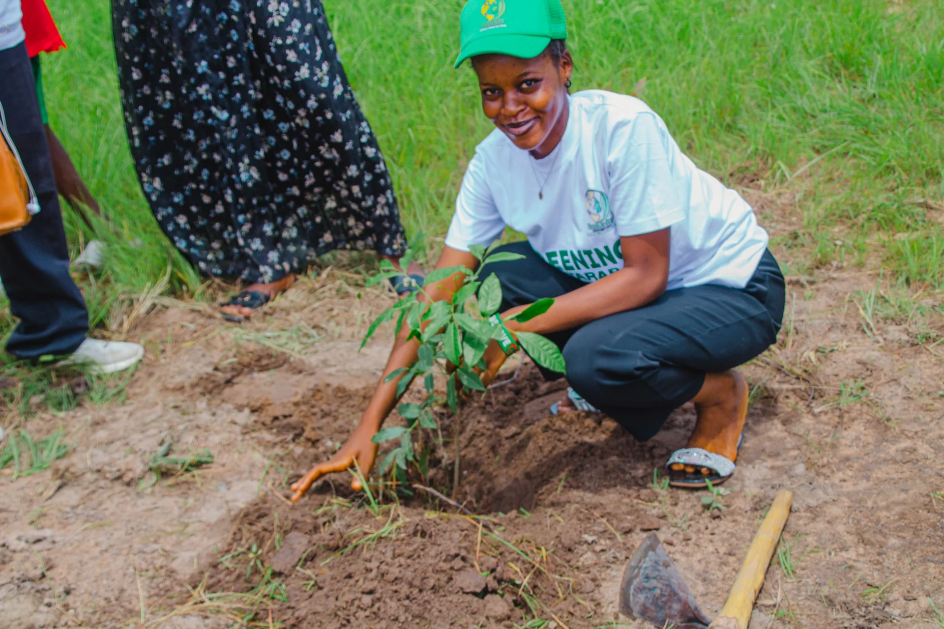 Young people planting trees together in a community reforestation effort